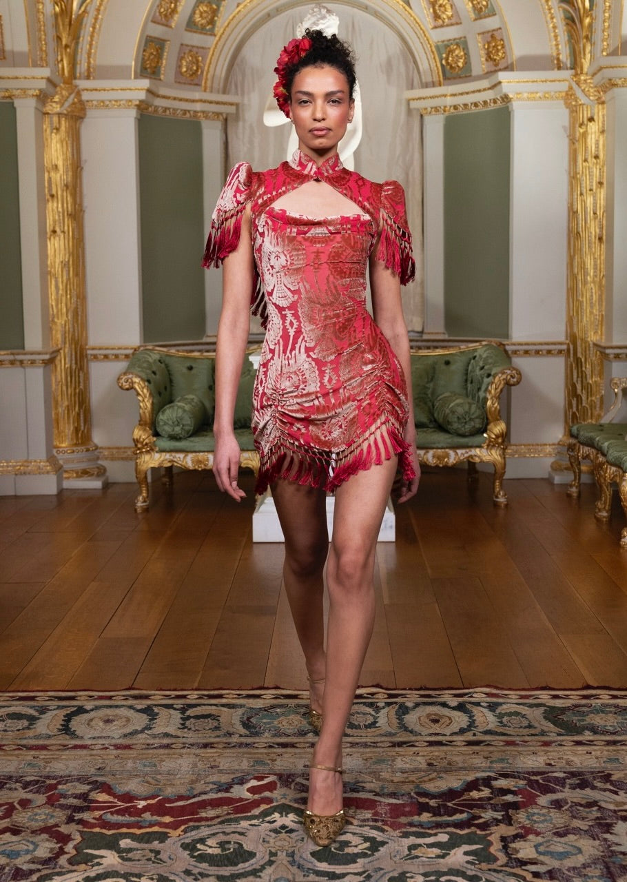 A crimson velvet mini dress from Annie's Collection, hand-finished with beadwork