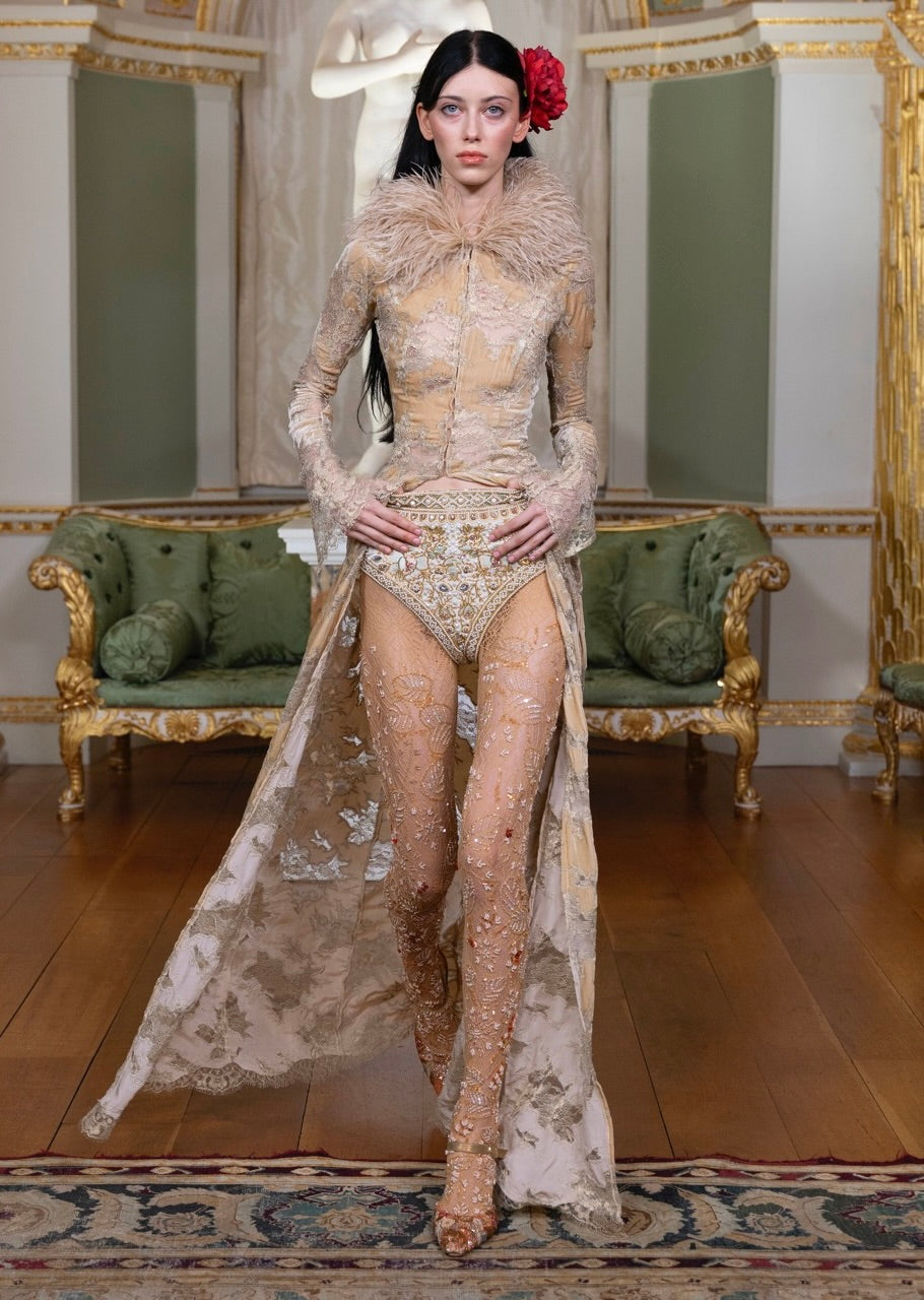 A hand-beaded ivory lace gown from Annie's Ibiza on the London Fashion Week runway